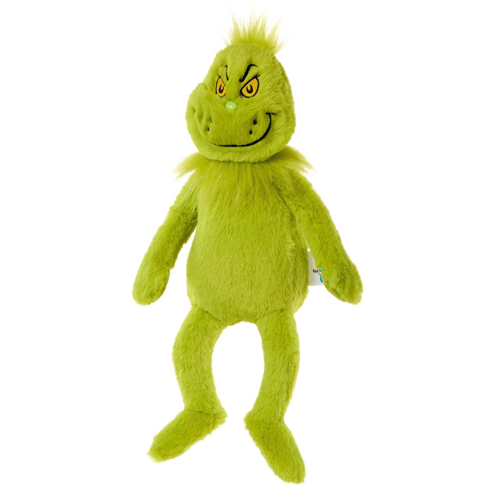 Green plush toy with a smiling face on a white background